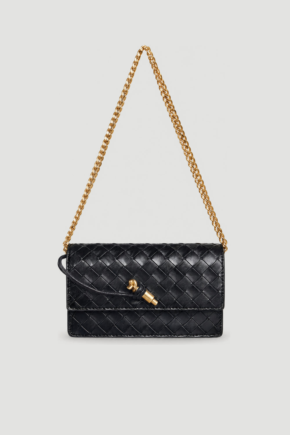 Black woven crossbody bag with a gold chain strap and clasp closure