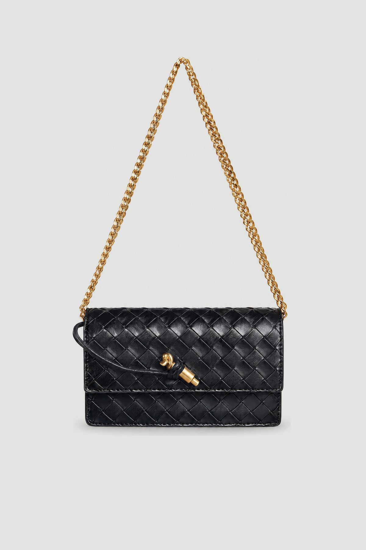 Black woven crossbody bag with a gold chain strap and clasp closure