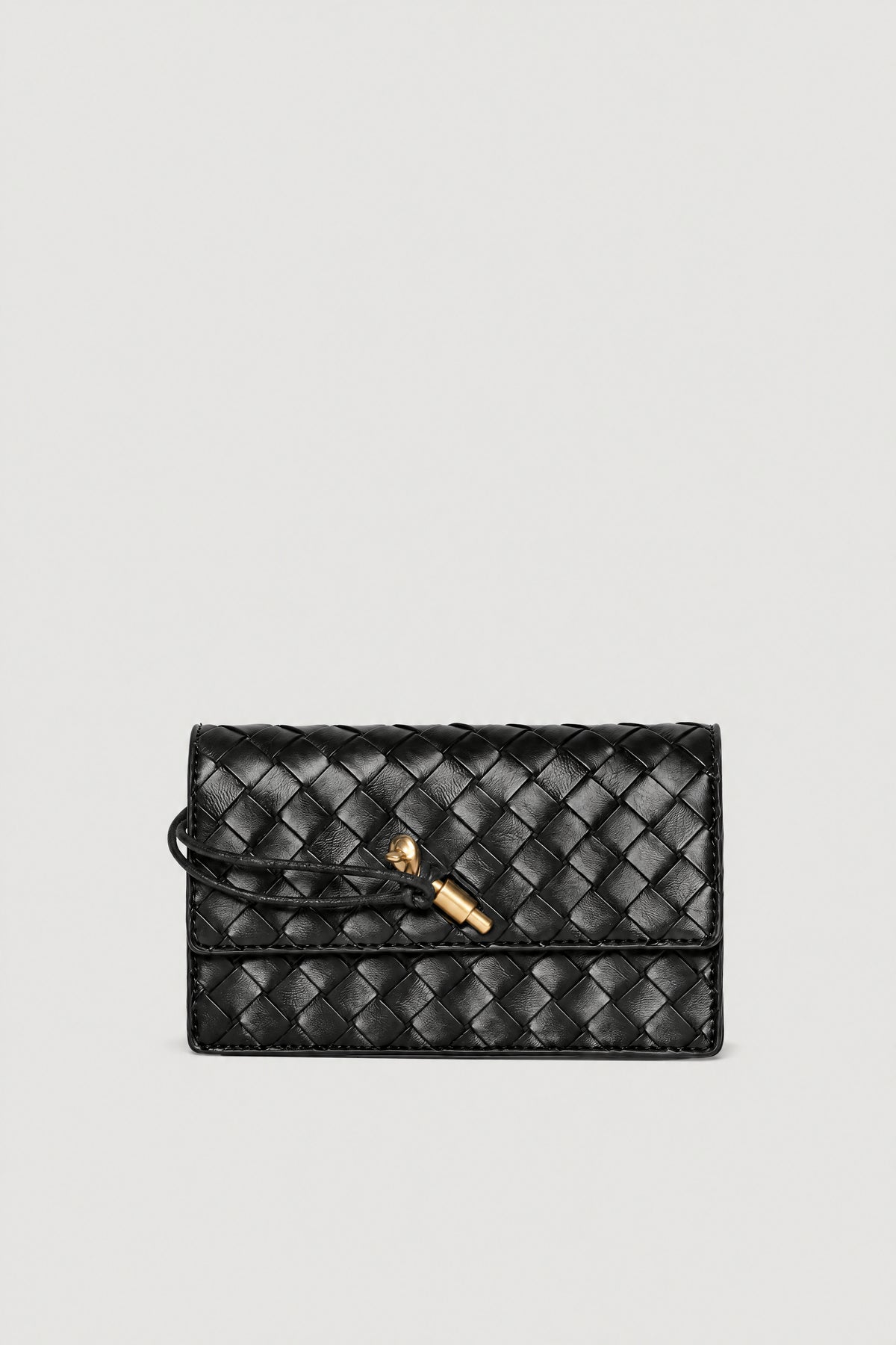 Black woven crossbody bag with quilted texture and gold clasp closure