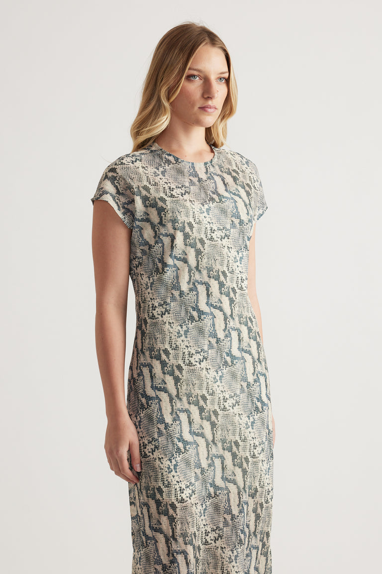 Woman wearing a grey and cream abstract patterned short sleeve midi dress