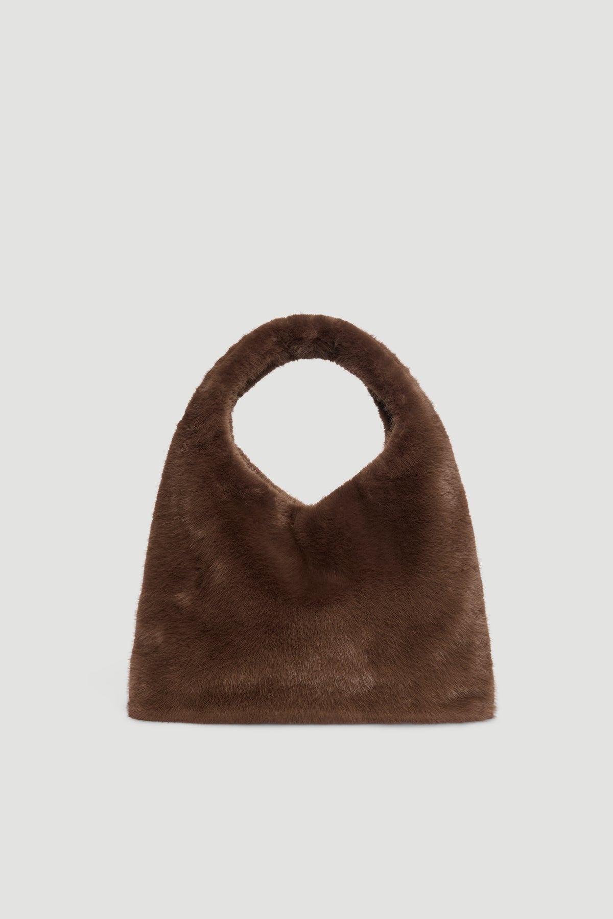 Soft chocolate brown fluffy tote bag with rounded handle for a cozy, stylish everyday accessory.