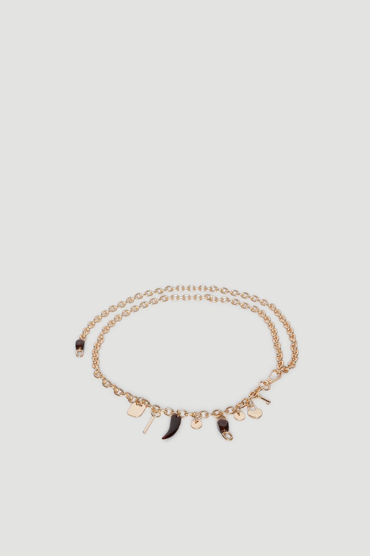 Gold chain belt adorned with multiple small dangling charms
