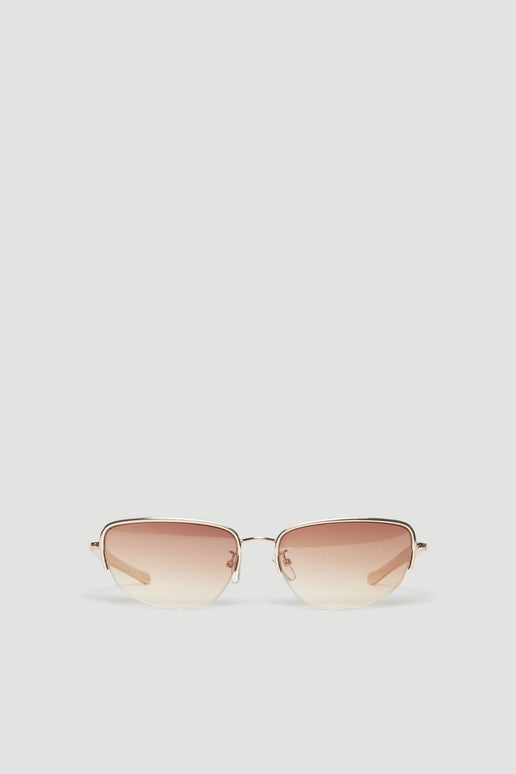 Gold cat eye sunglasses with ombre pink and clear lenses and slim metal arms