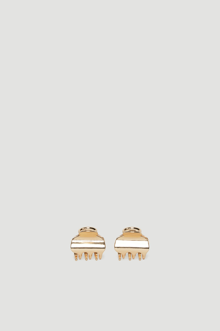 Pair of small gold-tone mini hair claws with a smooth polished finish for everyday versatile styling.