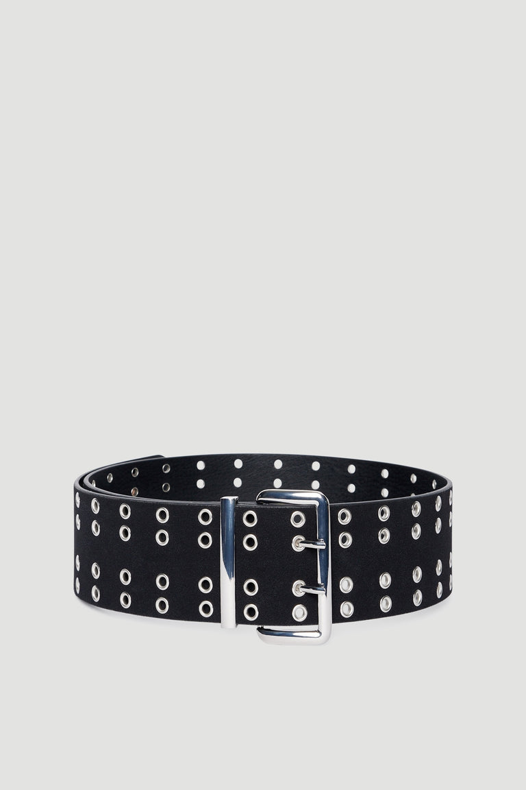 Black faux leather belt with multiple silver eyelets and a large silver buckle and keeper on neutral background