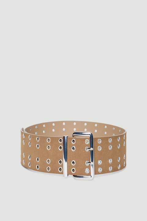 Wide tan faux leather belt with oversized silver buckle and multiple circular eyelet details against plain background
