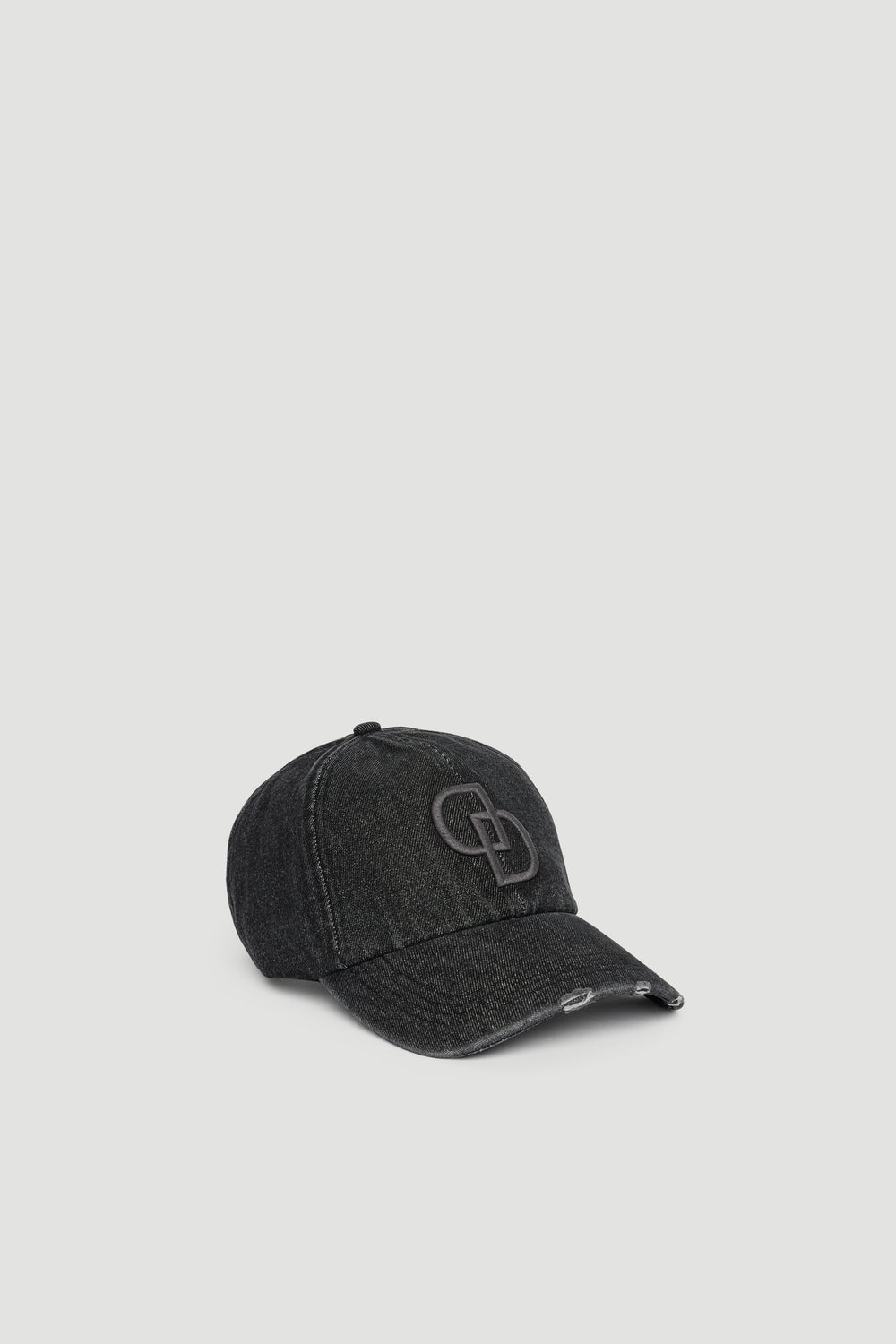 Black washed denim baseball cap with subtle distressing and raised embroidered logo on front panel