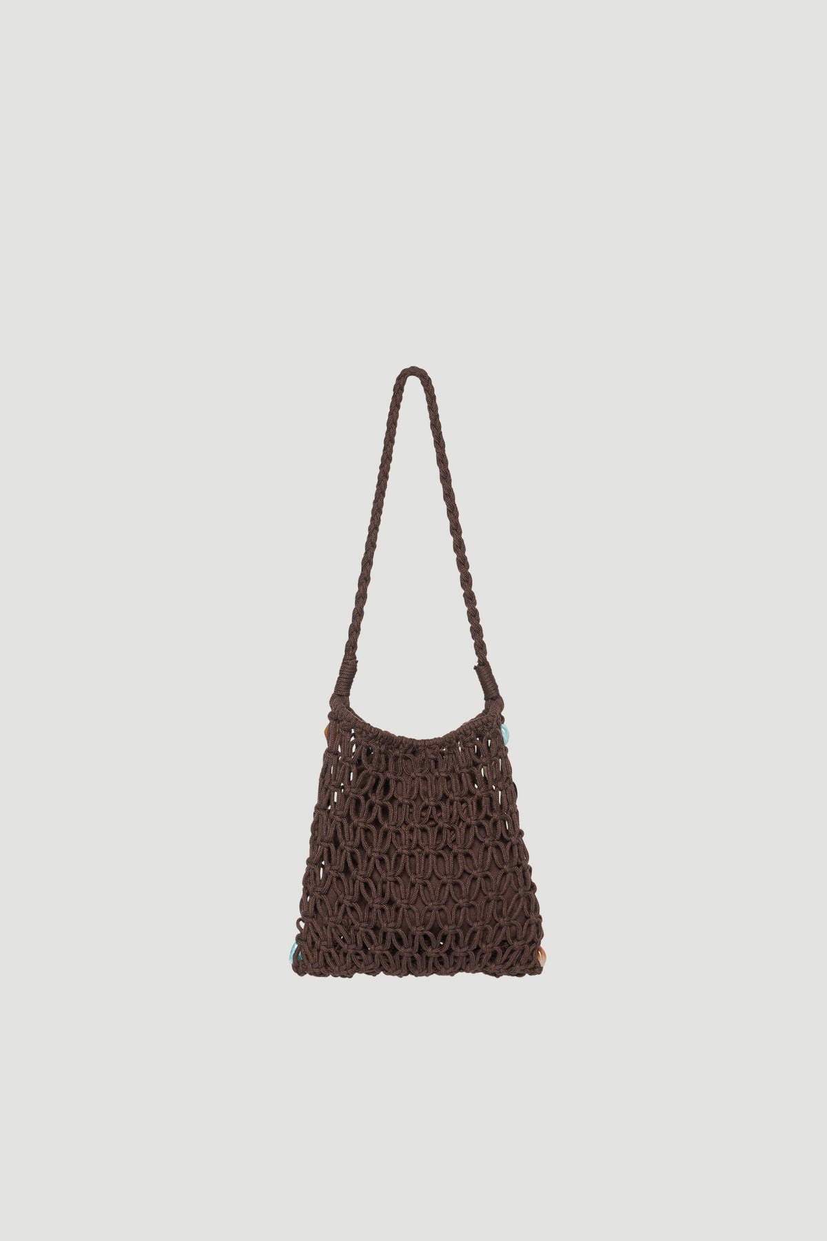 Brown handwoven shoulder bag with a reticulated design and long strap