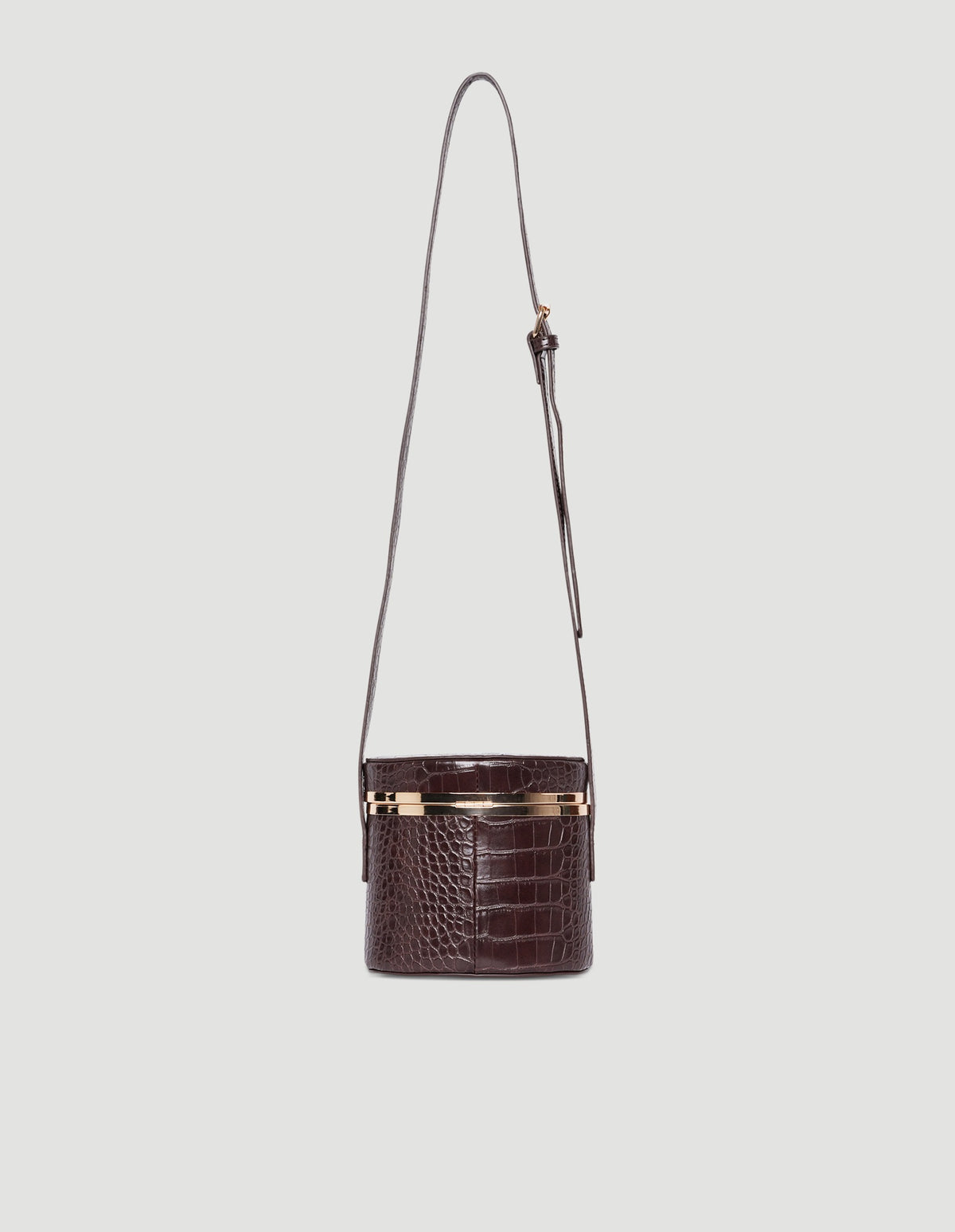Small structured crossbody bag in textured chocolate brown with gold hardware and adjustable strap