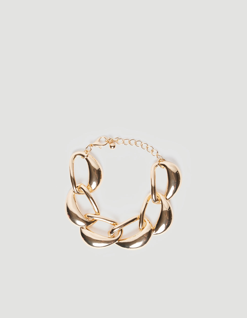 Chunky gold-tone link bracelet with polished teardrop-shaped chain links and adjustable extension clasp