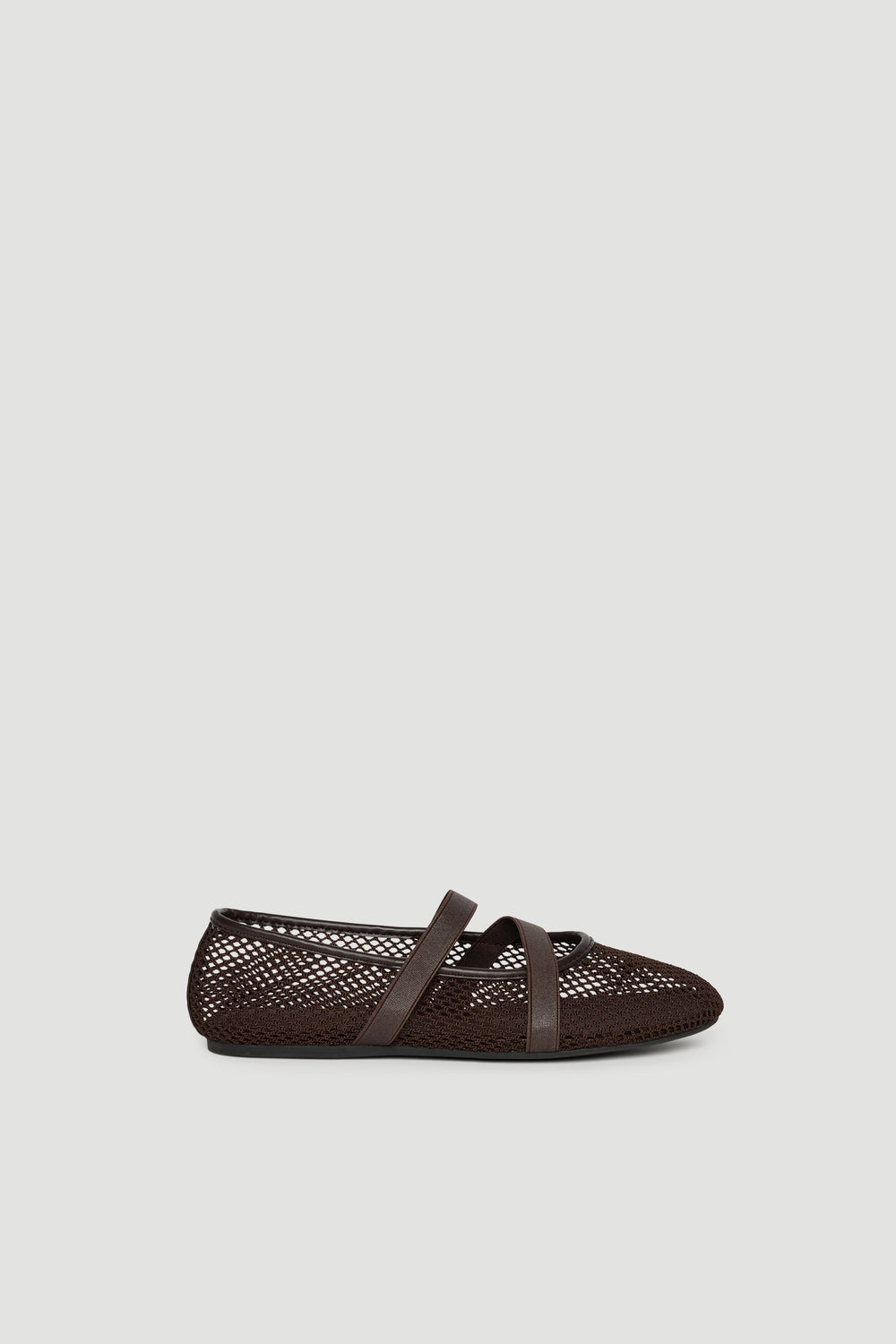 Dark brown breathable ballet flat with cross strap and sleek, lightweight design for effortless everyday wear.
