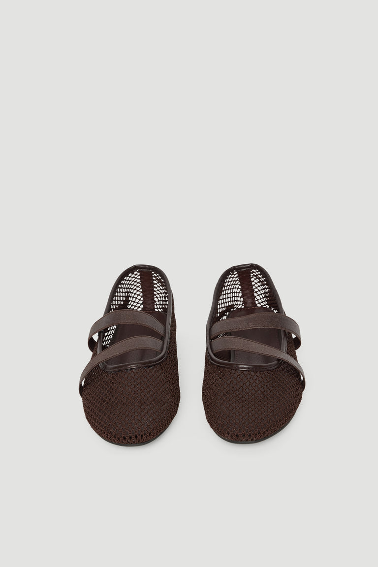 Dark brown ballet flats with breathable mesh upper and crossed elastic straps for a comfortable, sporty look.