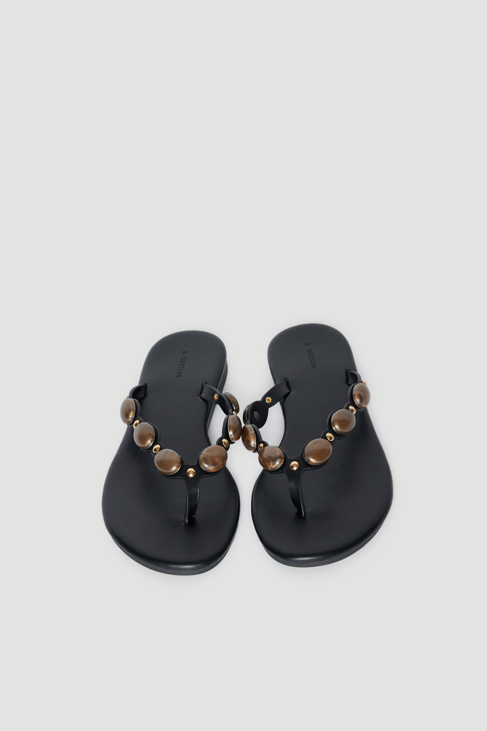 Black thong sandals with rounded gemstone embellished straps and cushioned footbeds
