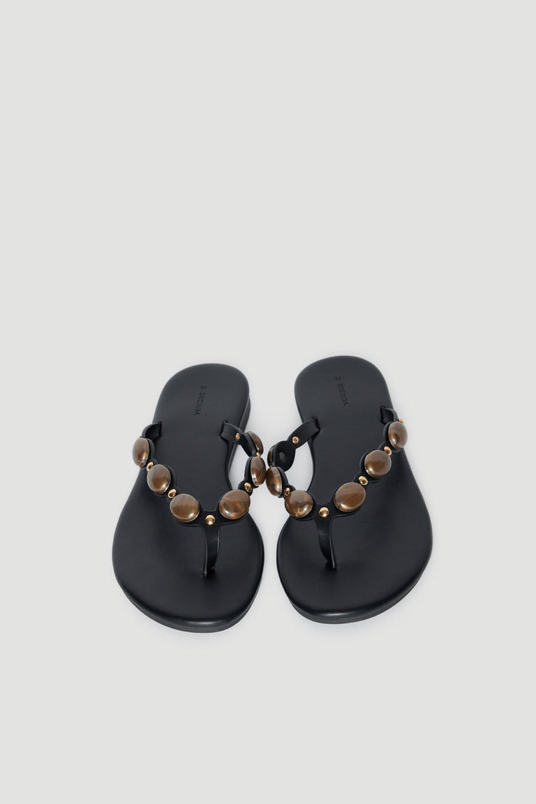 Black thong sandals with rounded gemstone embellished straps and cushioned footbeds