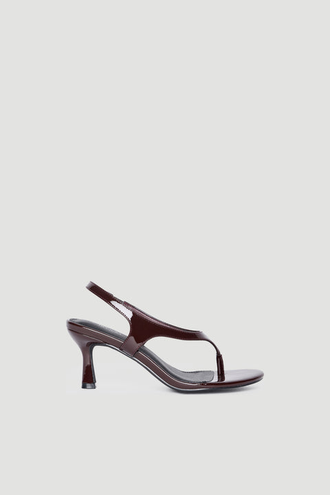 Glossy dark brown patent slingback heel with slim thong strap and curved stiletto for elevated style