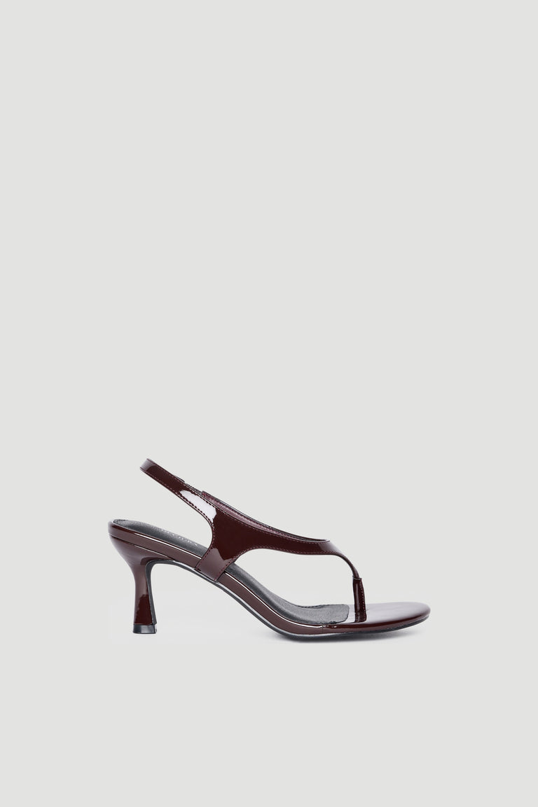 Glossy dark brown patent slingback heel with slim thong strap and curved stiletto for elevated style