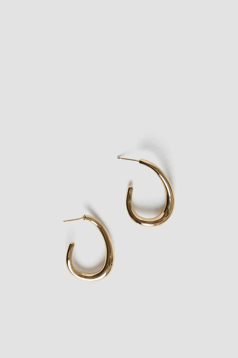 Polished gold-tone curved hoop earrings with a smooth, modern silhouette for versatile everyday wear.