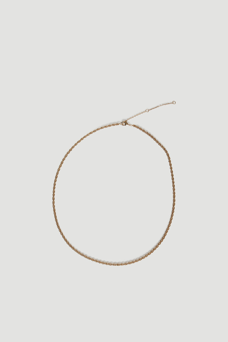 Gold twist chain necklace displayed against a neutral background