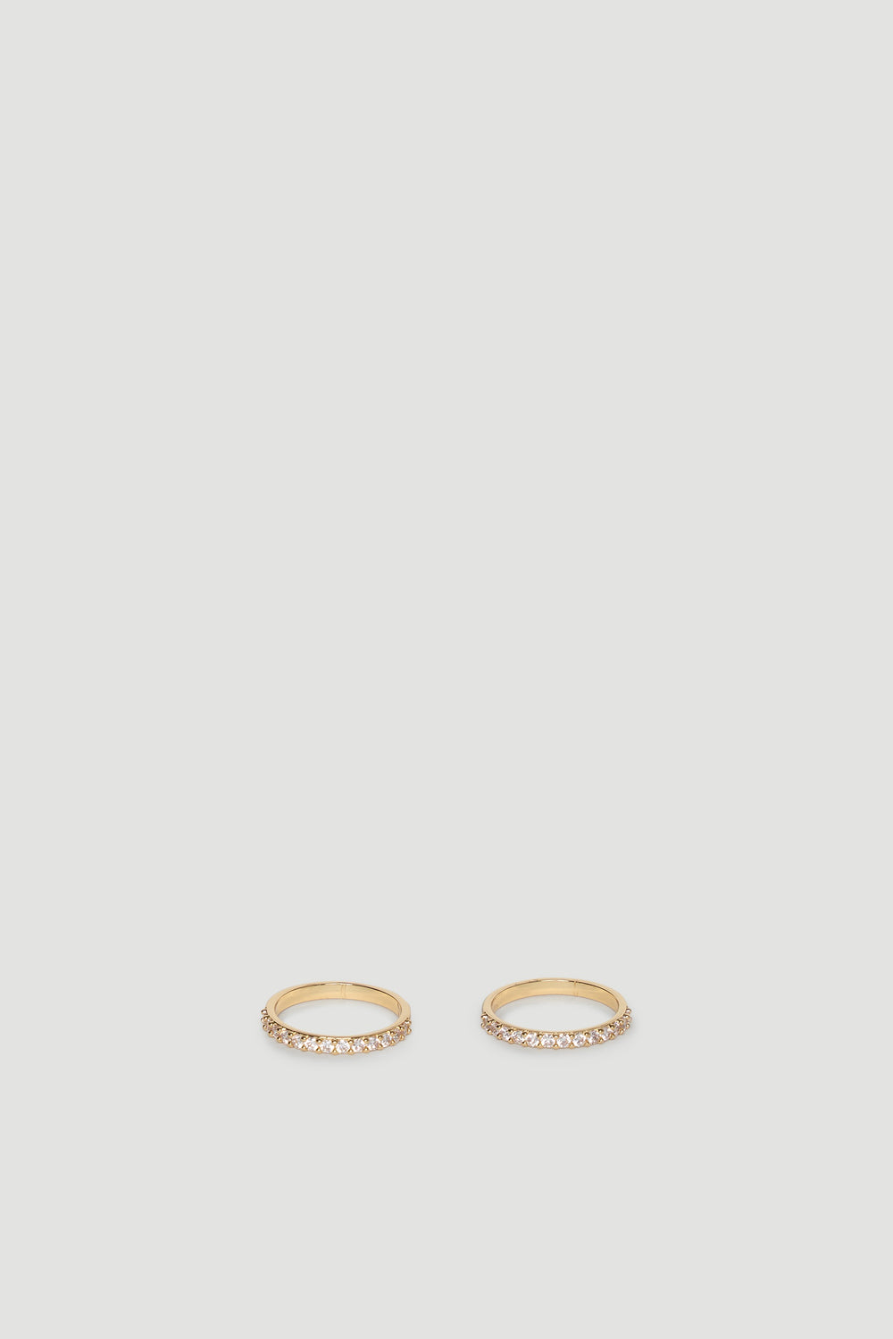 Two slender gold rings each set with a row of sparkling diamante stones for subtle, elegant shine.