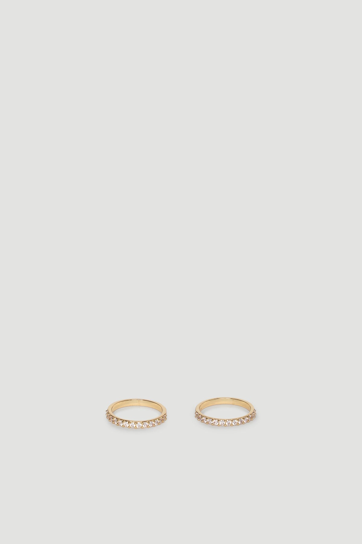 Two slender gold rings each set with a row of sparkling diamante stones for subtle, elegant shine.