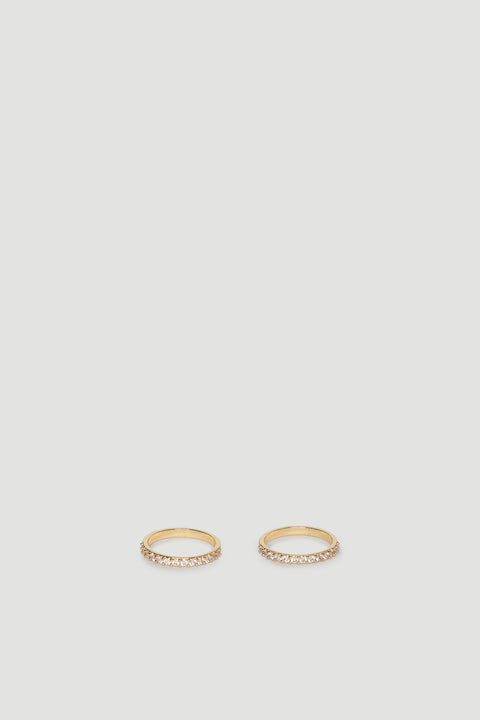 Two slender gold rings each set with a row of sparkling diamante stones for subtle, elegant shine.