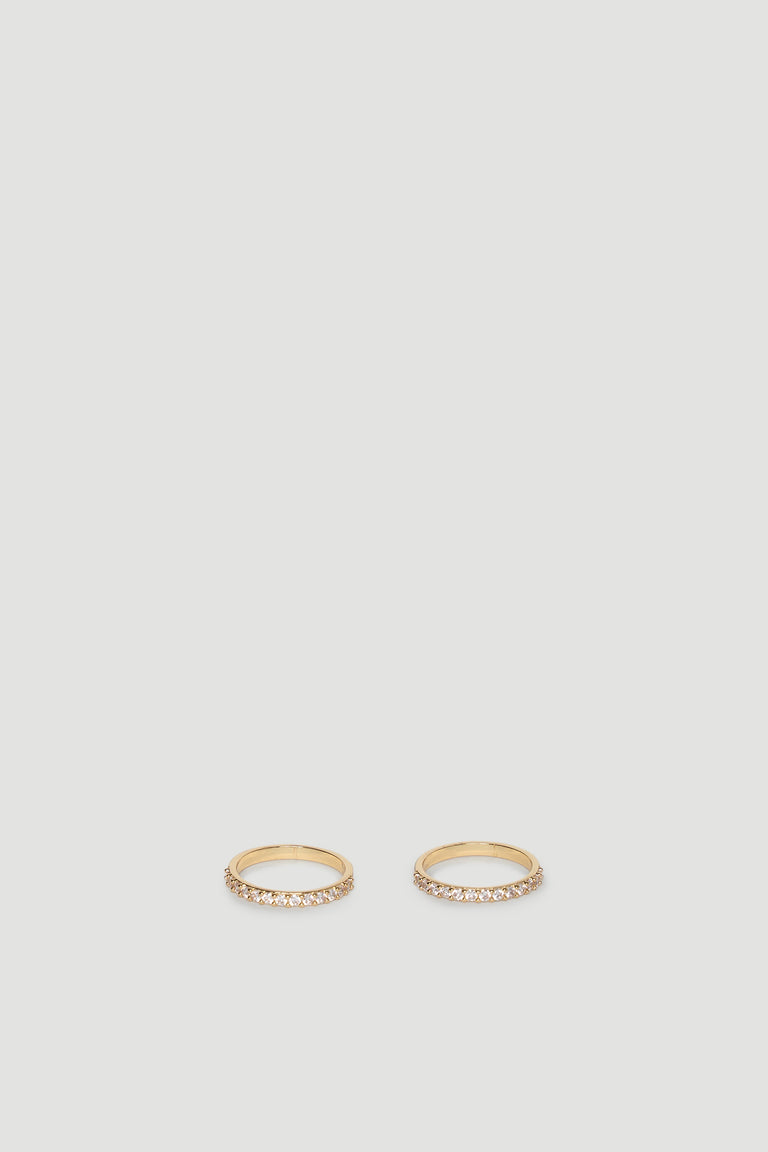 Two slender gold rings each set with a row of sparkling diamante stones for subtle, elegant shine.