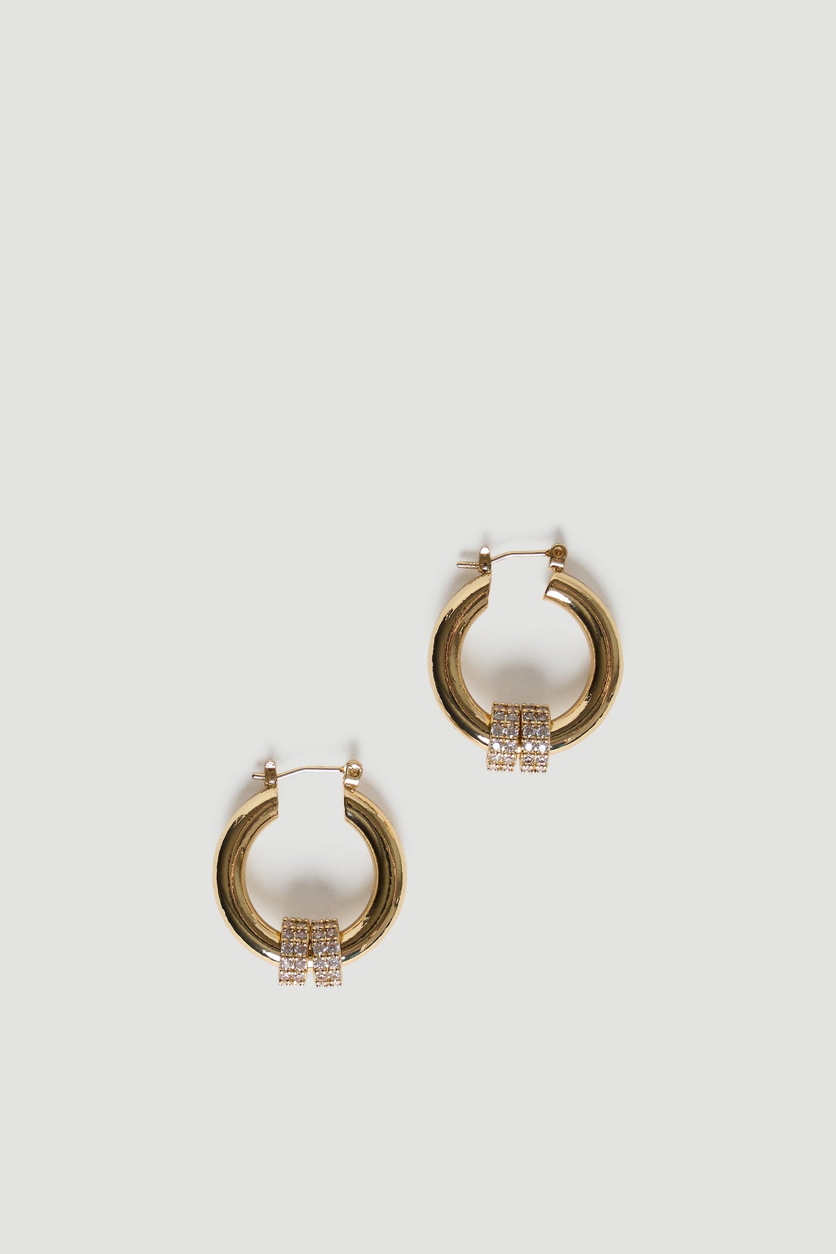 Polished gold hoop earrings with twin rows of sparkling stones for a refined and timeless accessory look.