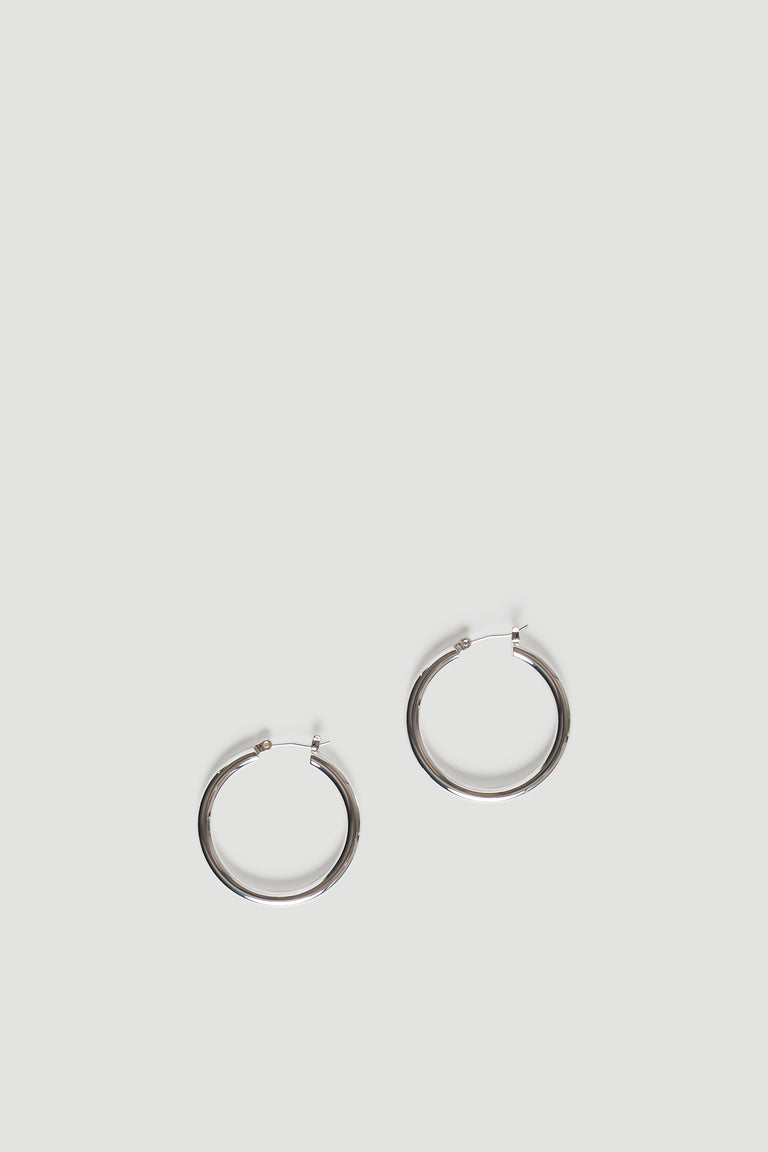 Minimalist pair of polished gold-tone hoops with a smooth finish, designed for everyday elegance and ease.