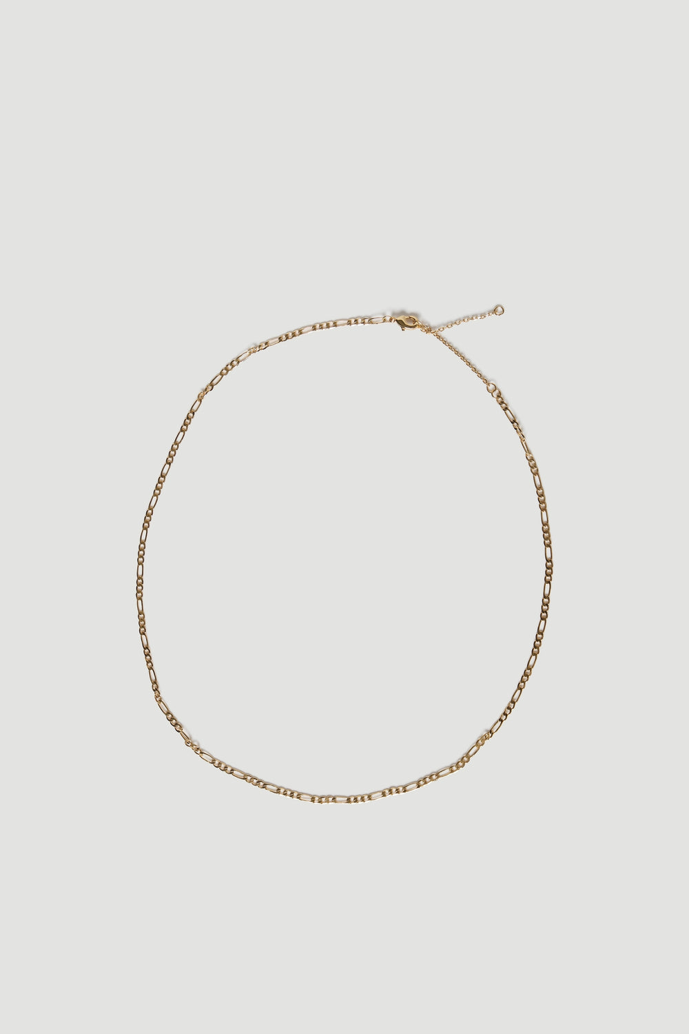 Gold plated Figaro chain necklace with delicate links and an adjustable clasp