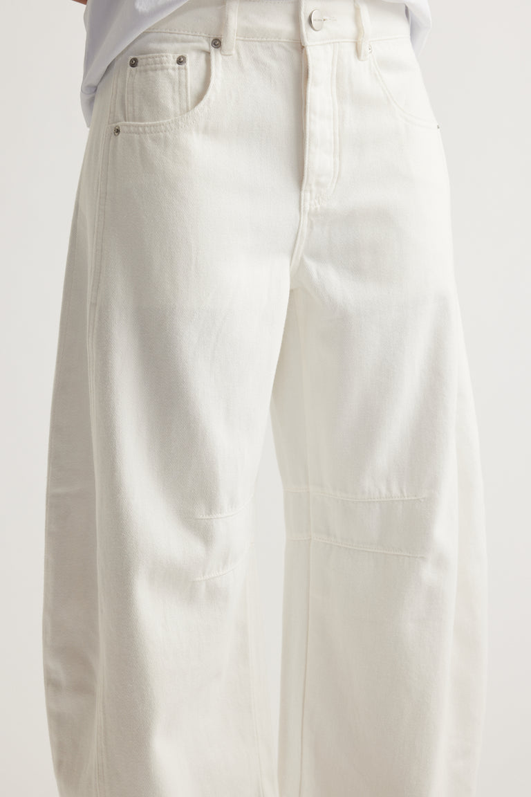White high rise barrel leg jeans with button fly, front seam details and cropped length