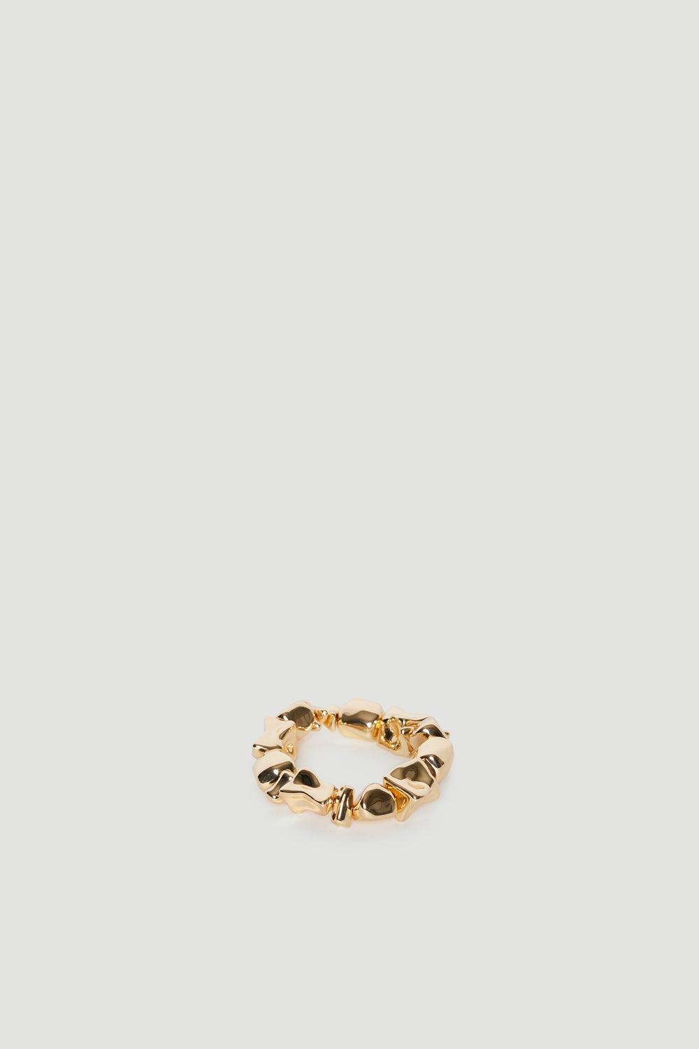 Gold bracelet with uneven rock shaped beads