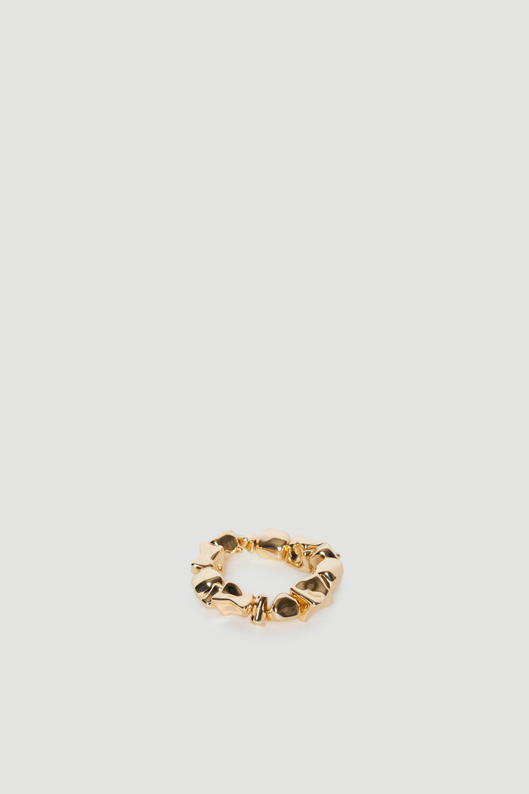 Gold bracelet with uneven rock shaped beads