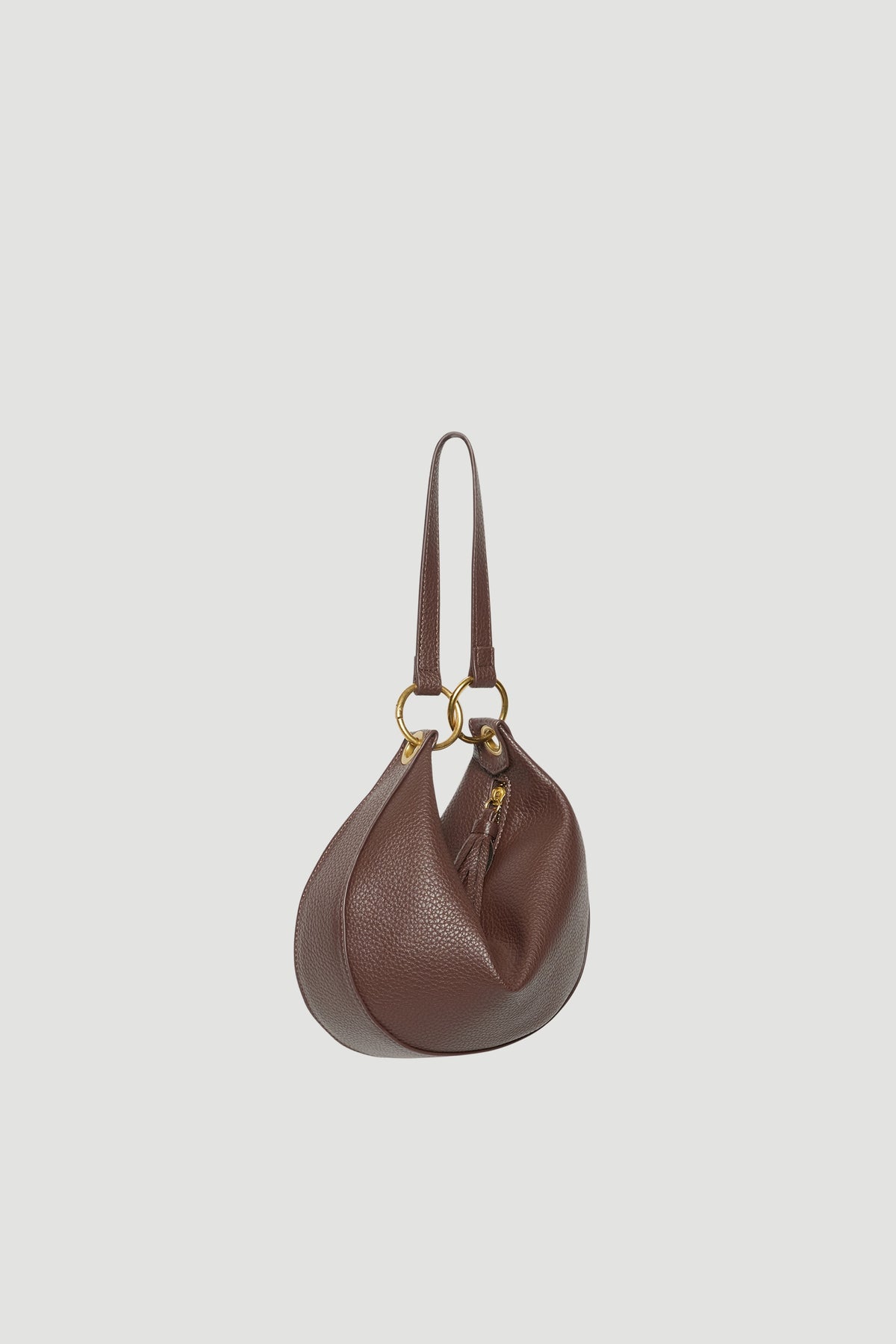 Brown half circle shoulder bag with gold ring hardware and a soft textured finish