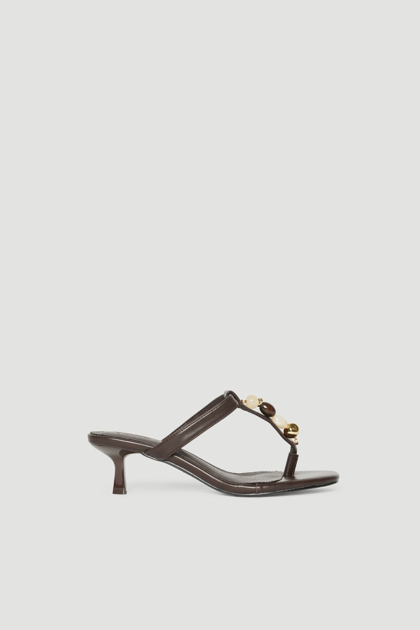 Brown thong kitten heel sandal with colourful gemstones and gold hardware