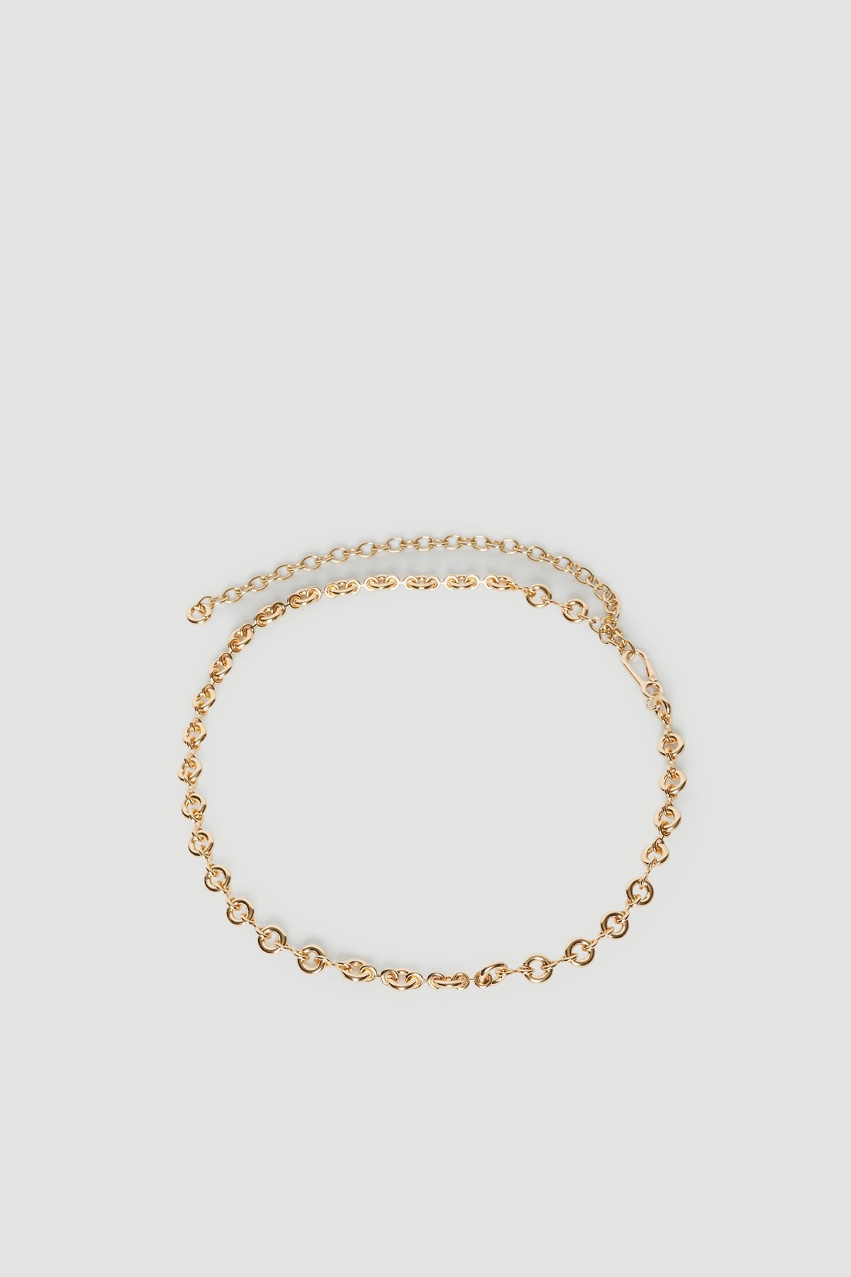Gold donut link chain belt with an extender chain and lobster clasp