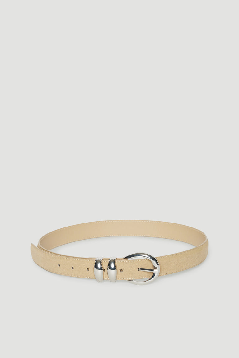 Beige faux suede belt with silver hardware and a large buckle