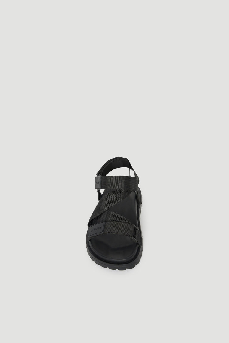 Black crossover strap sandal with a padded sole and supportive back strap