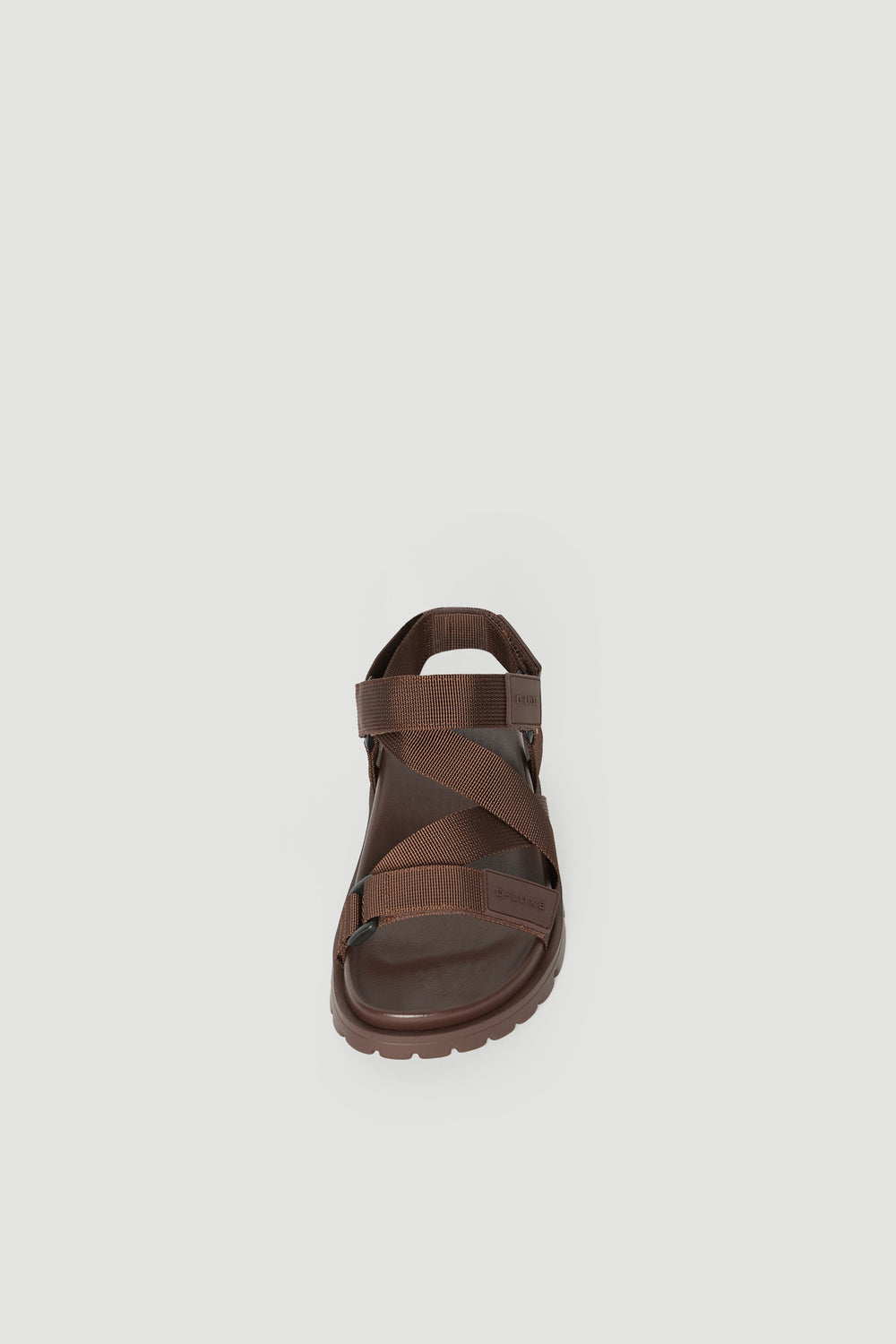 Brown crossover strap sandal with a padded sole and secure back strap