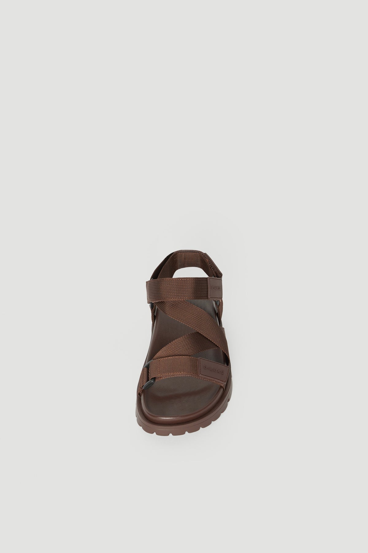 Brown crossover strap sandal with a padded sole and secure back strap