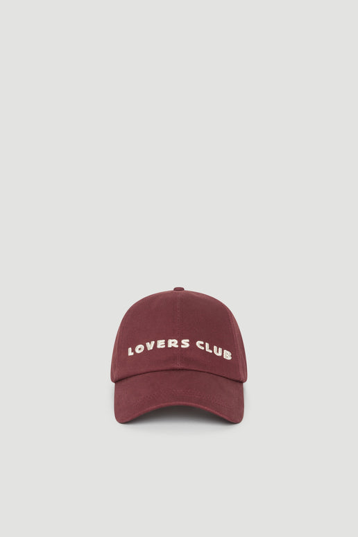 Burgundy baseball cap with embroidered Lovers Club logo and curved brim