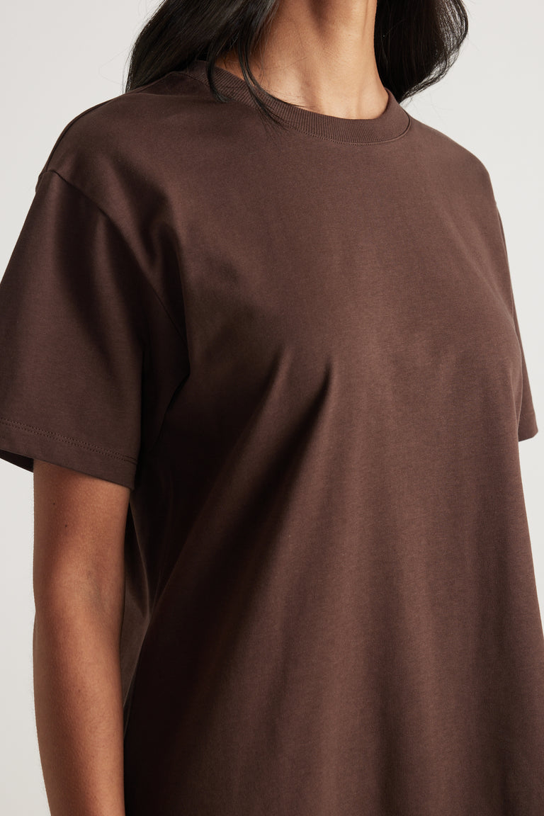 Woman wearing a chocolate brown crew neck short sleeve tee in a relaxed fit