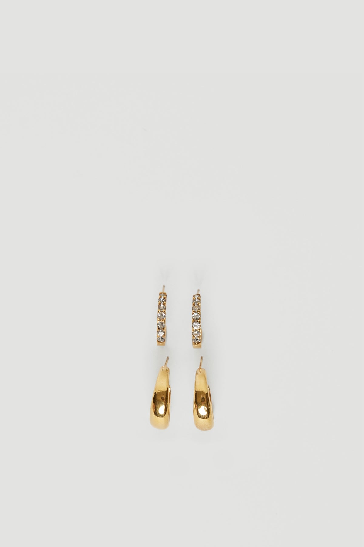 Pair of 18ct gold plated waterproof hoop earrings with elongated drop charms and textured detailing