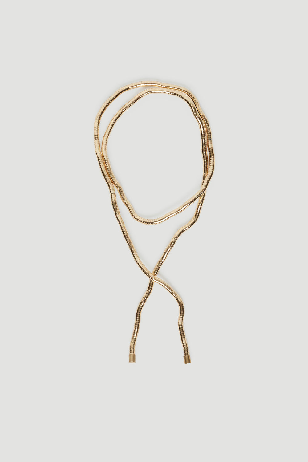 Delicate gold-tone wrap necklace with textured links, perfect for adding subtle elegance to any outfit