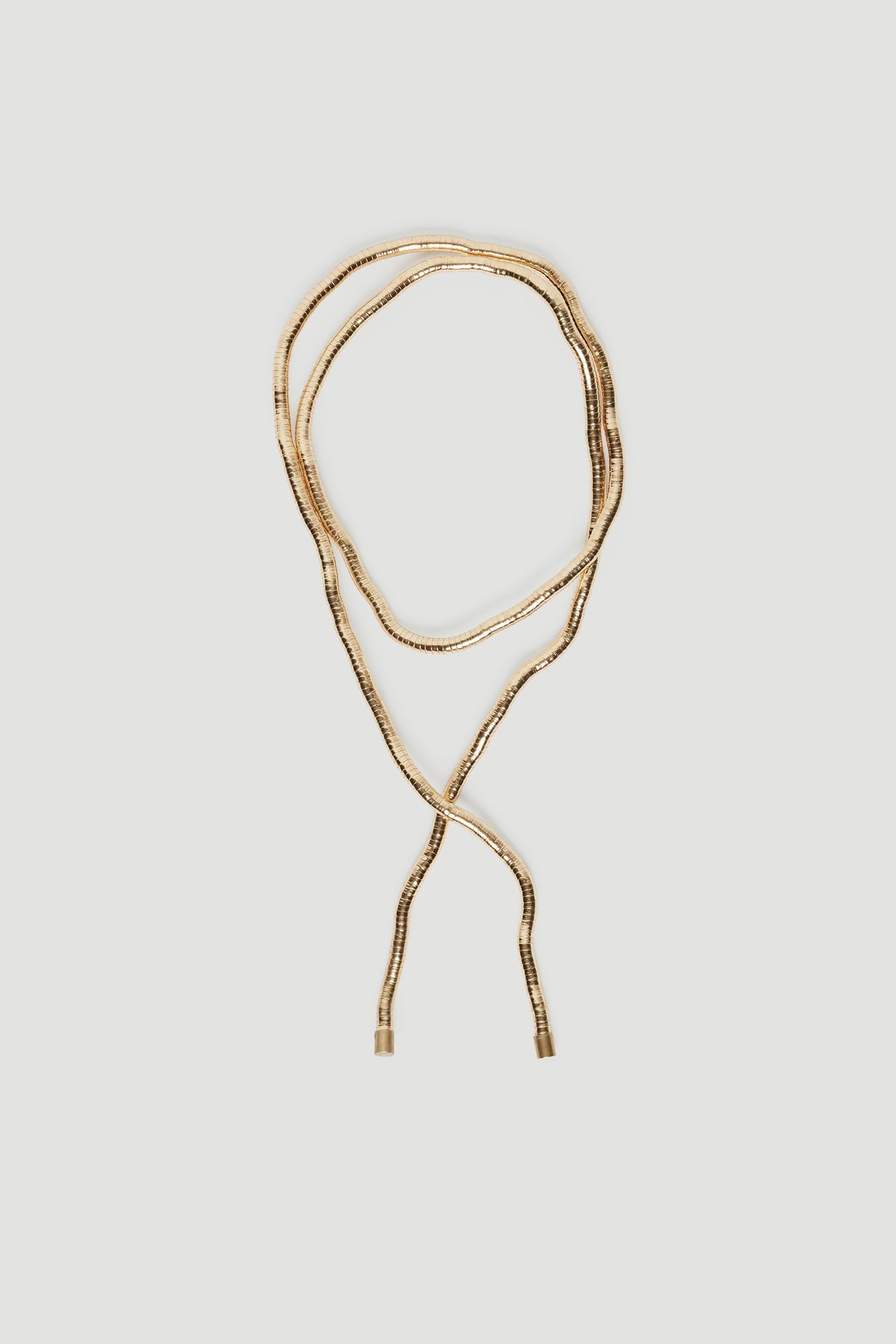 Delicate gold-tone wrap necklace with textured links, perfect for adding subtle elegance to any outfit
