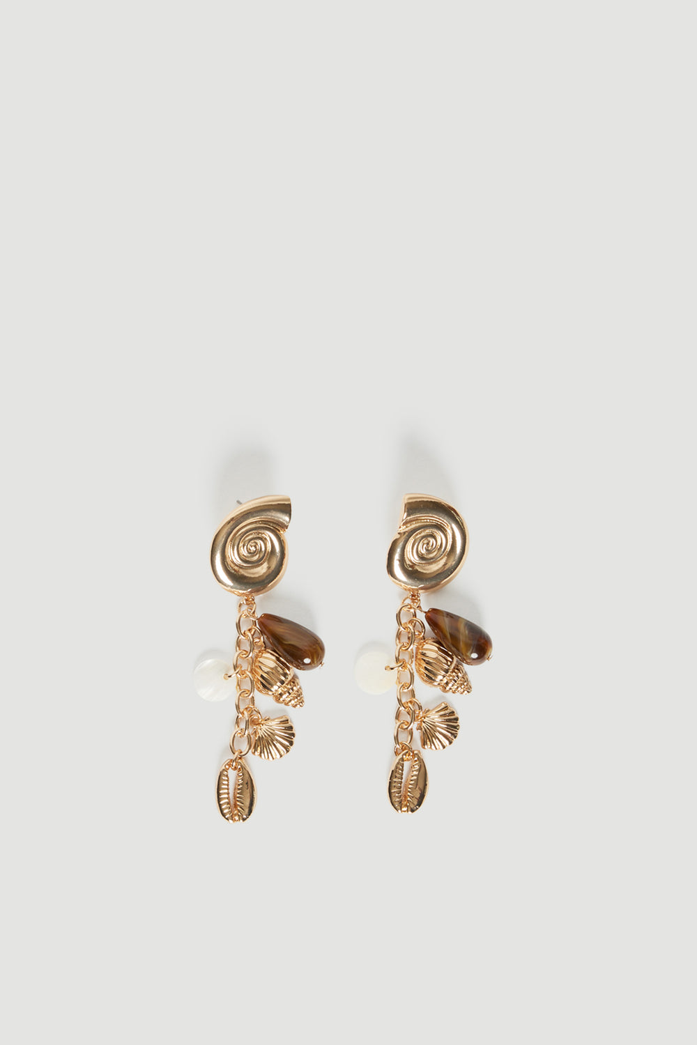Pair of high shine gold shell tassel earrings with spiral studs and multiple hanging pendants