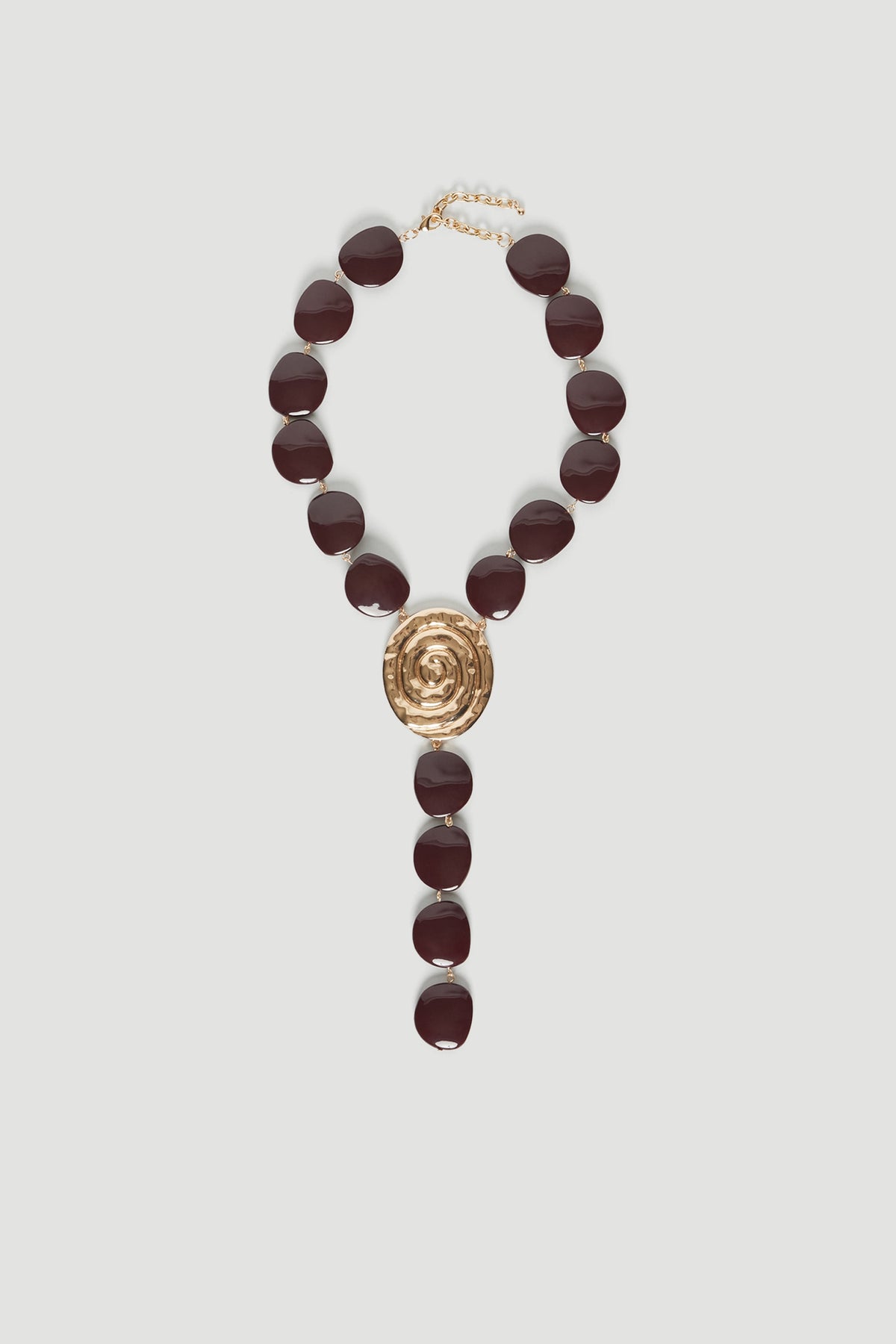 Chocolate bead lariat necklace with a gold shell pendant and lobster clasp closure
