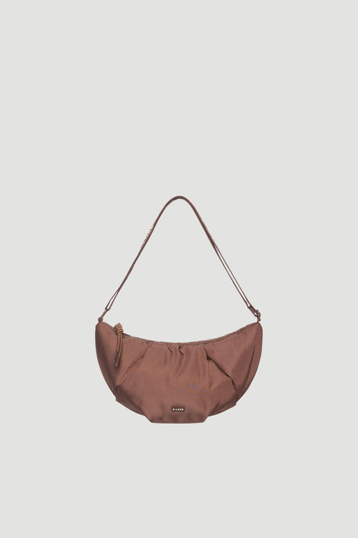 Brown medium puffed crossbody bag with a curved shape and adjustable strap