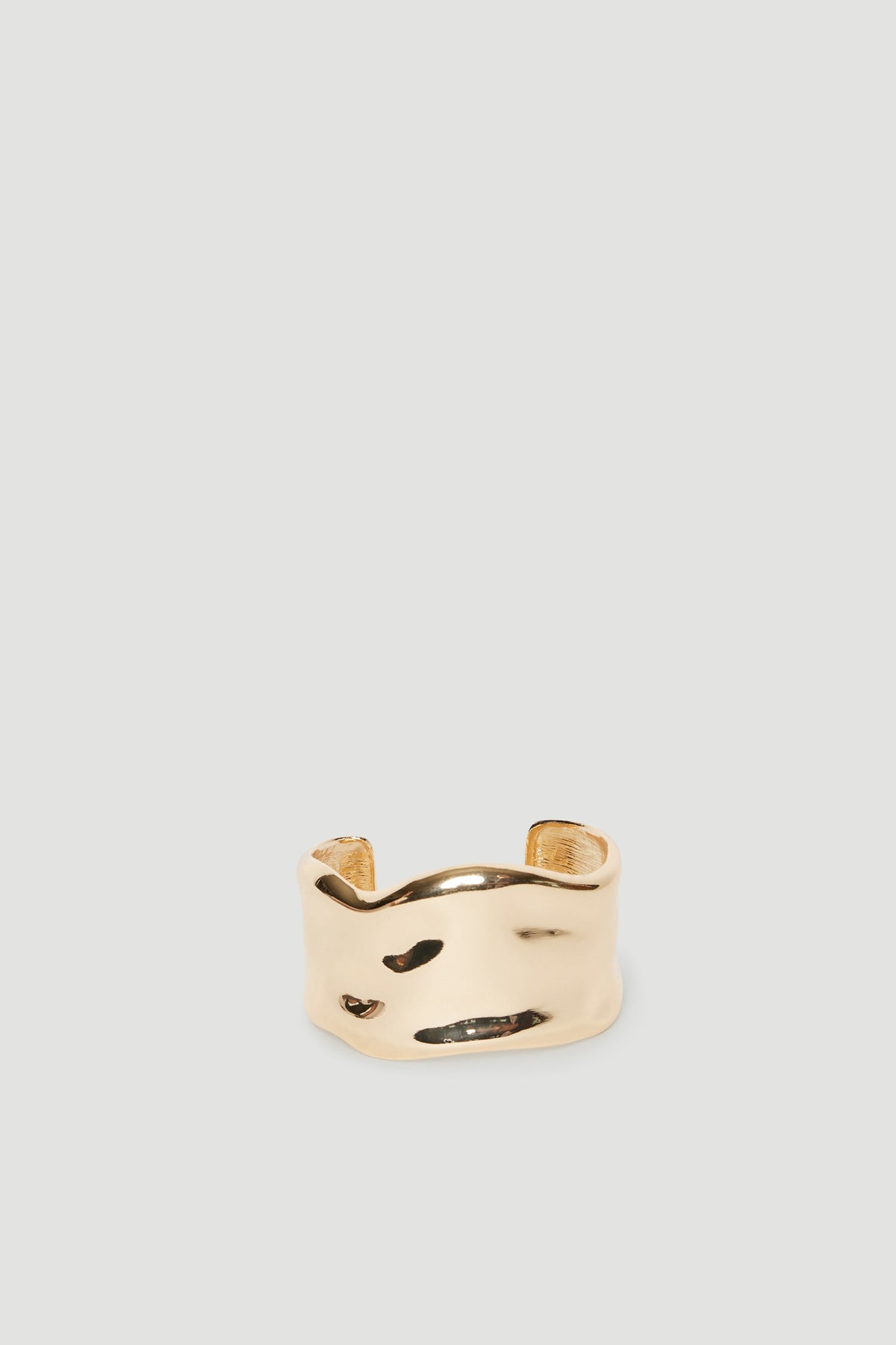 Wide ivory cuff bracelet with curved edges and abstract black detailing