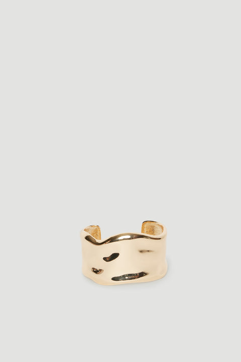 Wide ivory cuff bracelet with curved edges and abstract black detailing