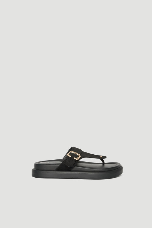 Black thong slide sandal with a buckled upper, gold hardware and a padded footbed
